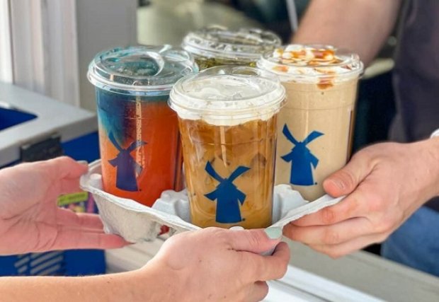 Dutch bros drink carrier with a variety of coffees and drinks